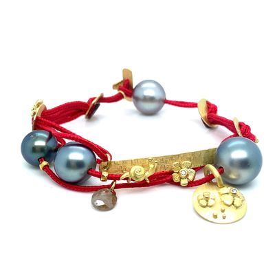 Tahitian pearl, rough diamond and 18K gold floral motif bracelet on nylon cord