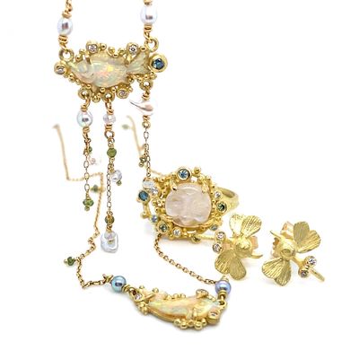 Sea, sky and garden opal pieces are set in 18K gold and diamonds with tiny akoya pearls from a small family owned business in Vietnam.  