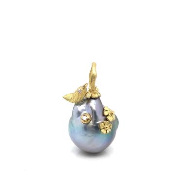 Large floral Tahitian pearl pendant with accent diamonds.